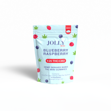 A light blue pouch of Jolly Cannabis Blueberry Raspberry Gummies (5mg THC, 125mg CBD), featuring raspberry, blueberry, and cannabis leaf art. The label shows a 1:25 THC:CBD ratio and contains 15 Arizona-made gummies.