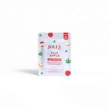 A packet of Jolly Cannabis Fuji Apple Gummies (5mg THC, 125mg CBD), hybrid fruit puree gummies made in Arizona, features apple and cannabis leaf designs and a 1:25 THC:CBD ratio on the label.