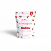 A white pouch with strawberry and hemp leaf designs holds Jolly Cannabis Strawberry Gummies 5mg THC, 125mg CBD. The upright label features 1:25 THC:CBD and Hemp Derived Nano THC Mini Gummies, made in Arizona, on a white background.