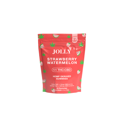 A red resealable pouch of Jolly Cannabis Strawberry Watermelon Gummies features fruit slice art and green hemp leaves, clearly labeled 1:1 15mg THC/15mg CBD per gummy. Each Arizona-made bag contains 15 hemp-derived gummies.